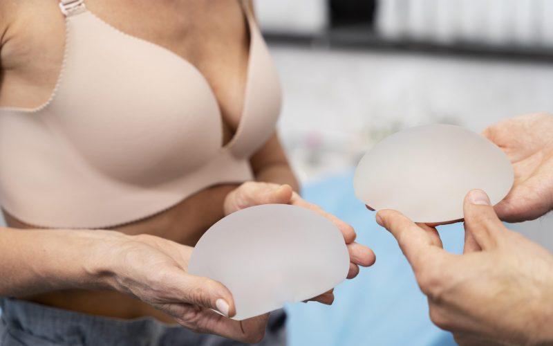close-up-hands-holding-breast-implants
